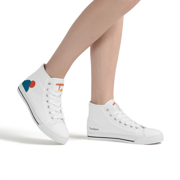 Sunrise sneakers worn by a model, showcasing the clean white canvas and colorful abstract elements on the heel.