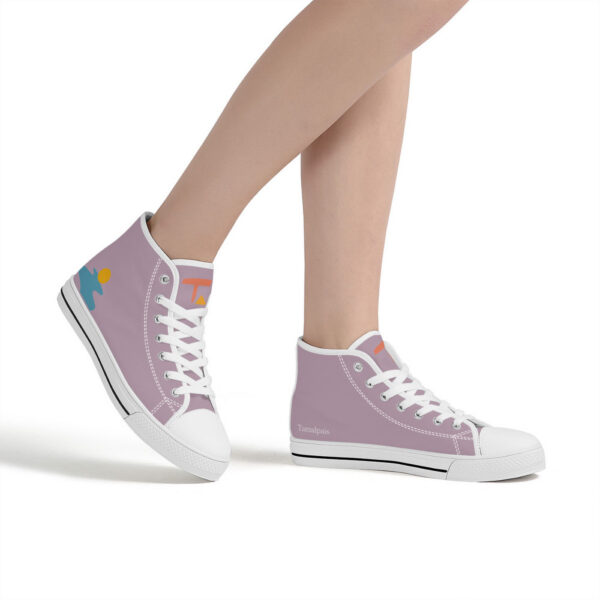 The Watercourse sneakers worn by a model, showing the soft lavender tones and abstract sun and water shapes in motion.