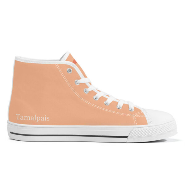 Left inside view of the 'Pyramids' sneaker, showcasing a minimalist peach canvas with the 'Tamalpais' brand printed near the heel.