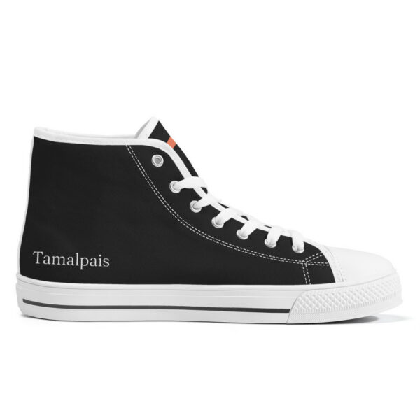 Inner left side of the Etel sneaker, displaying a clean black canvas with white laces and the Tamalpais logo printed near the heel.