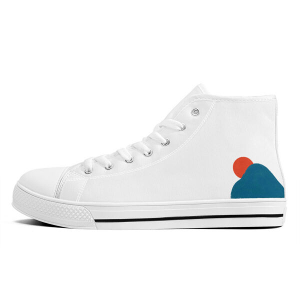 Outer left side of the Sunrise sneaker featuring a red circle and a dark teal mountain shape on white canvas, evoking a rising sun over a peak.