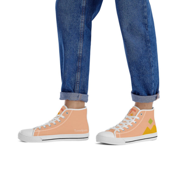 Model wearing the 'Pyramids' sneakers by Tamalpais, paired with rolled-up jeans, highlighting the colorful design and clean silhouette.