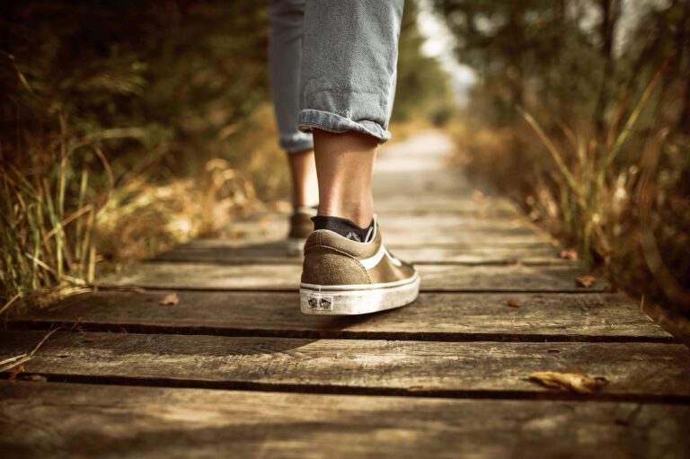 Slowwear Manifesto represented by a man walking in a forest