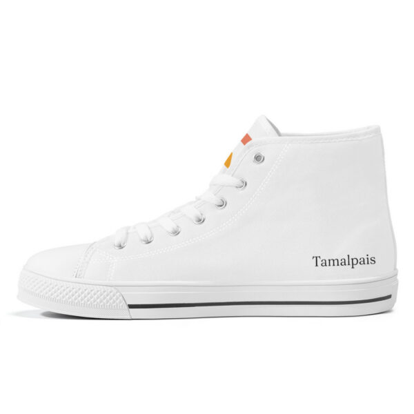 Inner right side of the Sunrise sneaker, white canvas with minimalist branding and stitched details.