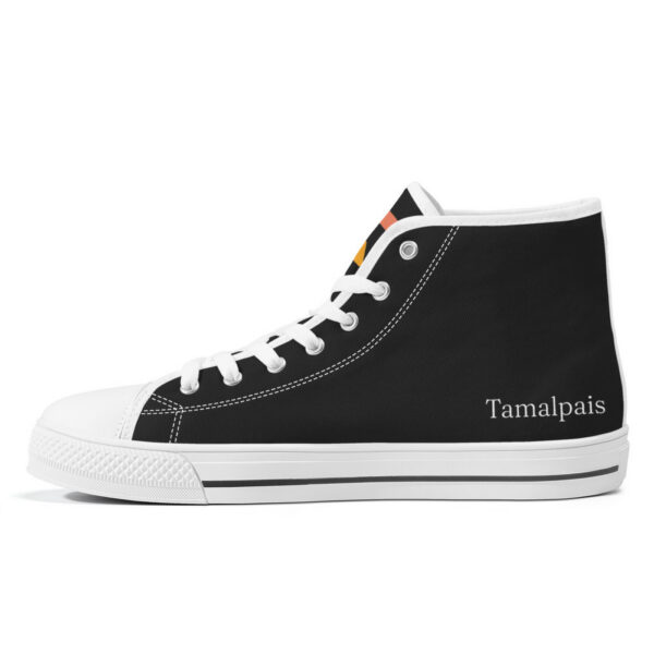 Inner right side of the Etel sneaker with minimal branding, black canvas, and white contrast stitching and laces.