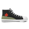 Outer right side of the Etel sneaker, with geometric color blocks: a red diamond over a sweeping olive green shape on black canvas.
