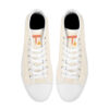 Top view of Tamalpais “Zénith” sneakers, cream canvas with orange T logo and triangle, white laces.